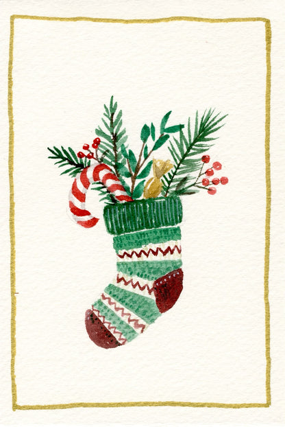 Carte de Noël à l'aquarelle : chaussette rayée garnie de sapin, sucre d'orge et baies